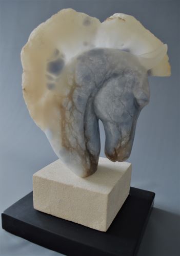 sculpture of a horse's head in alabaster on limestone and slate