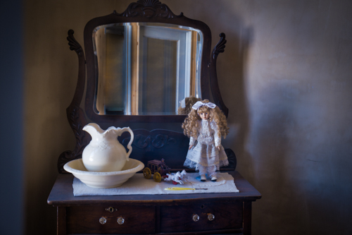 photograph of a dresser in an old West hotel