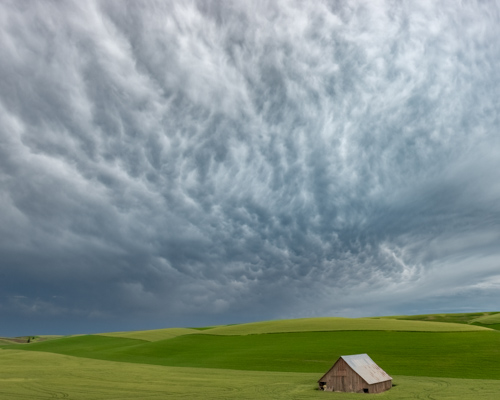 landscape photo of a rural scene with barn and big sky