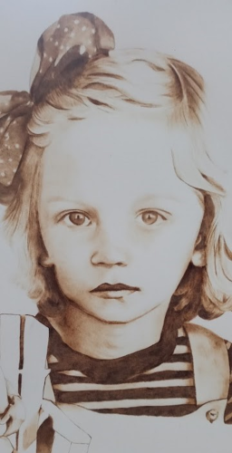 portrait of a young girl created with pyrography
