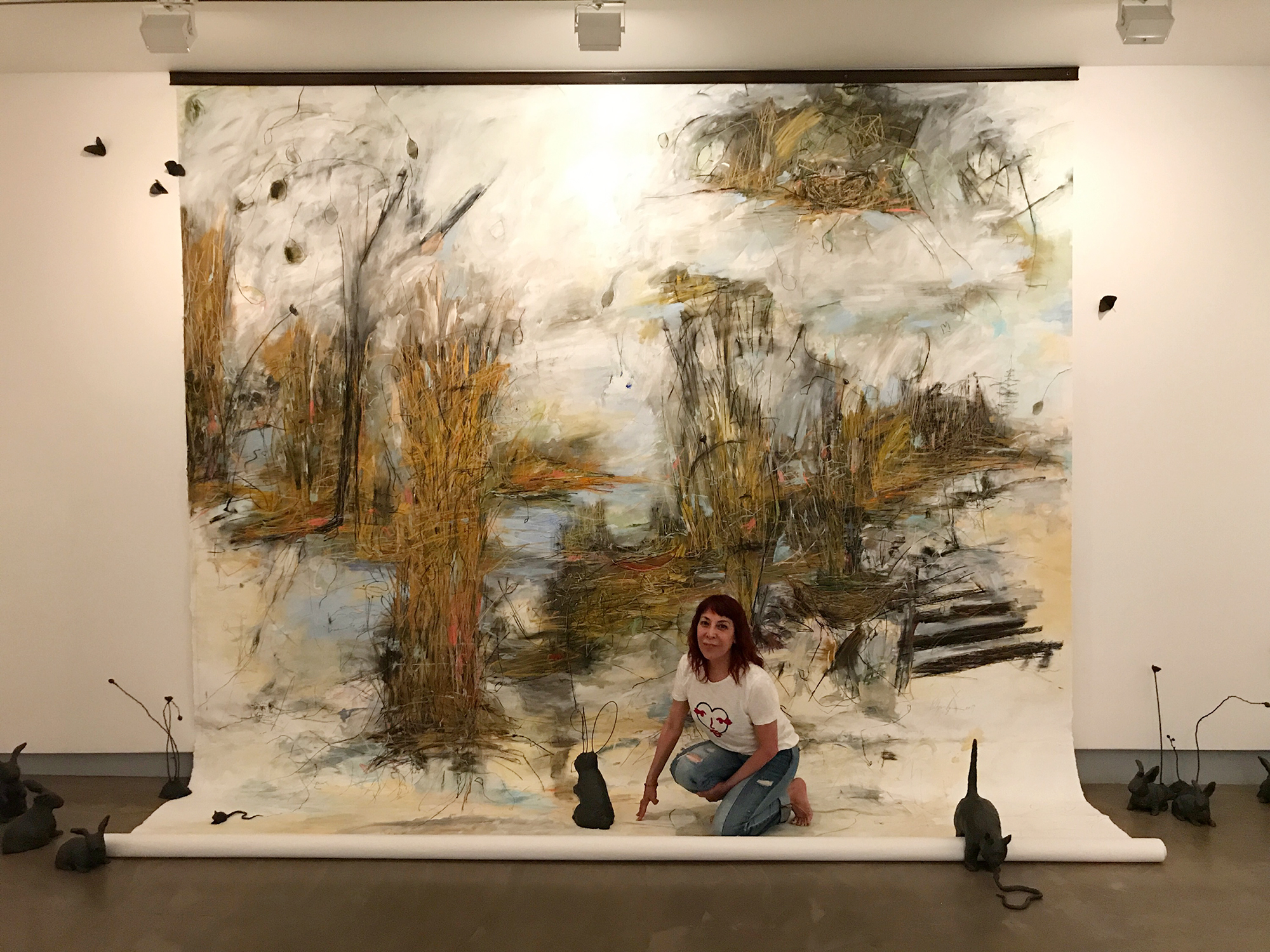 Renee Zangara poses with her artwork
