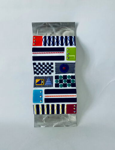 geometric design in glass on metal