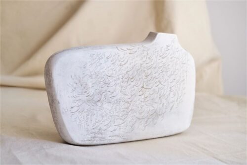 off-center handbuilt engraved vessel in ceramic