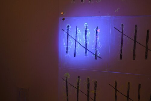 interactive UV light placed on artwork to transform image