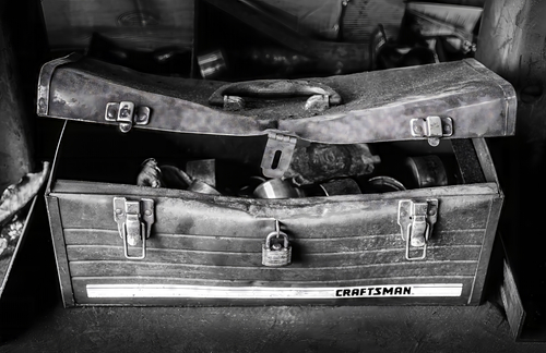 black and white photo of an old toolbox