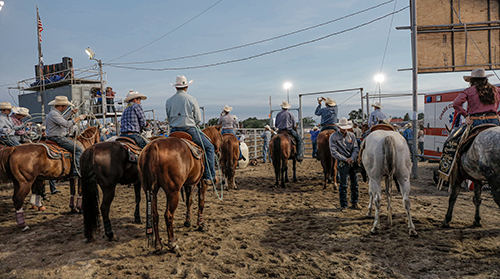 photograph of a bunch of cowboys on horseback
