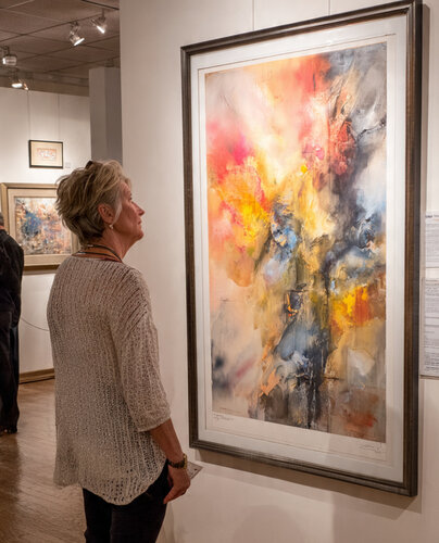 woman looking at a painting
