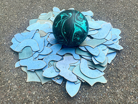 imaginary nest with shoe templates and a bowling ball