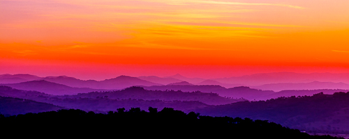 colorful photo of sunset over the mountains