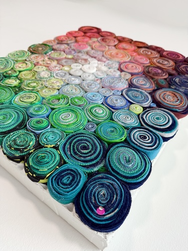 colorful upcycled materials sculptural collage