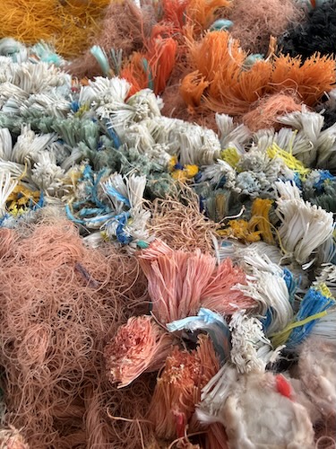 detail of triptych wall art made with industrial waste