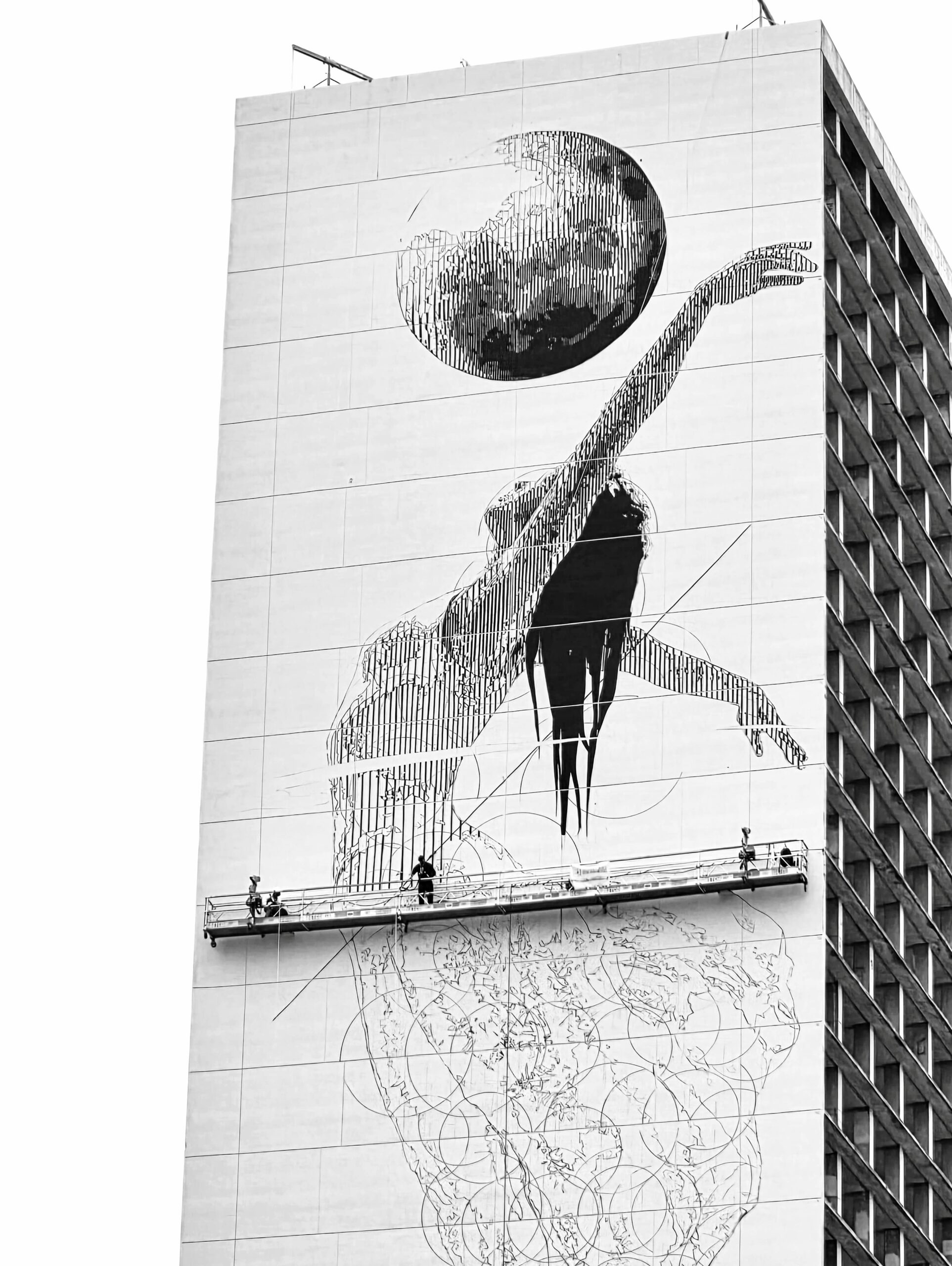 Photo by INO on September 17, 2026. May be a black-and-white image of brick wall, buildings and text.