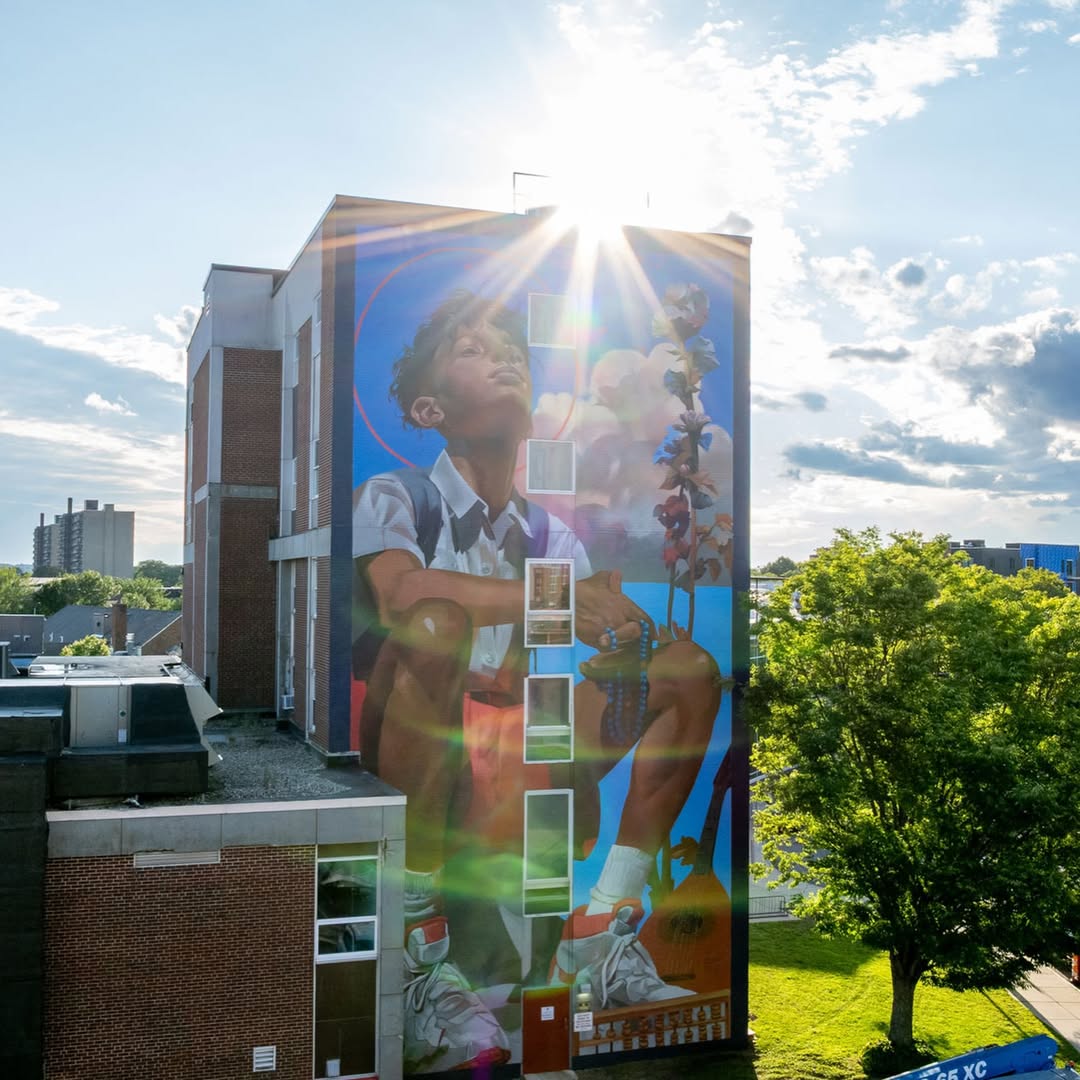 Photo by Taylor White on August 17, 2026. May be an image of basketball court, brick wall, buildings and text.