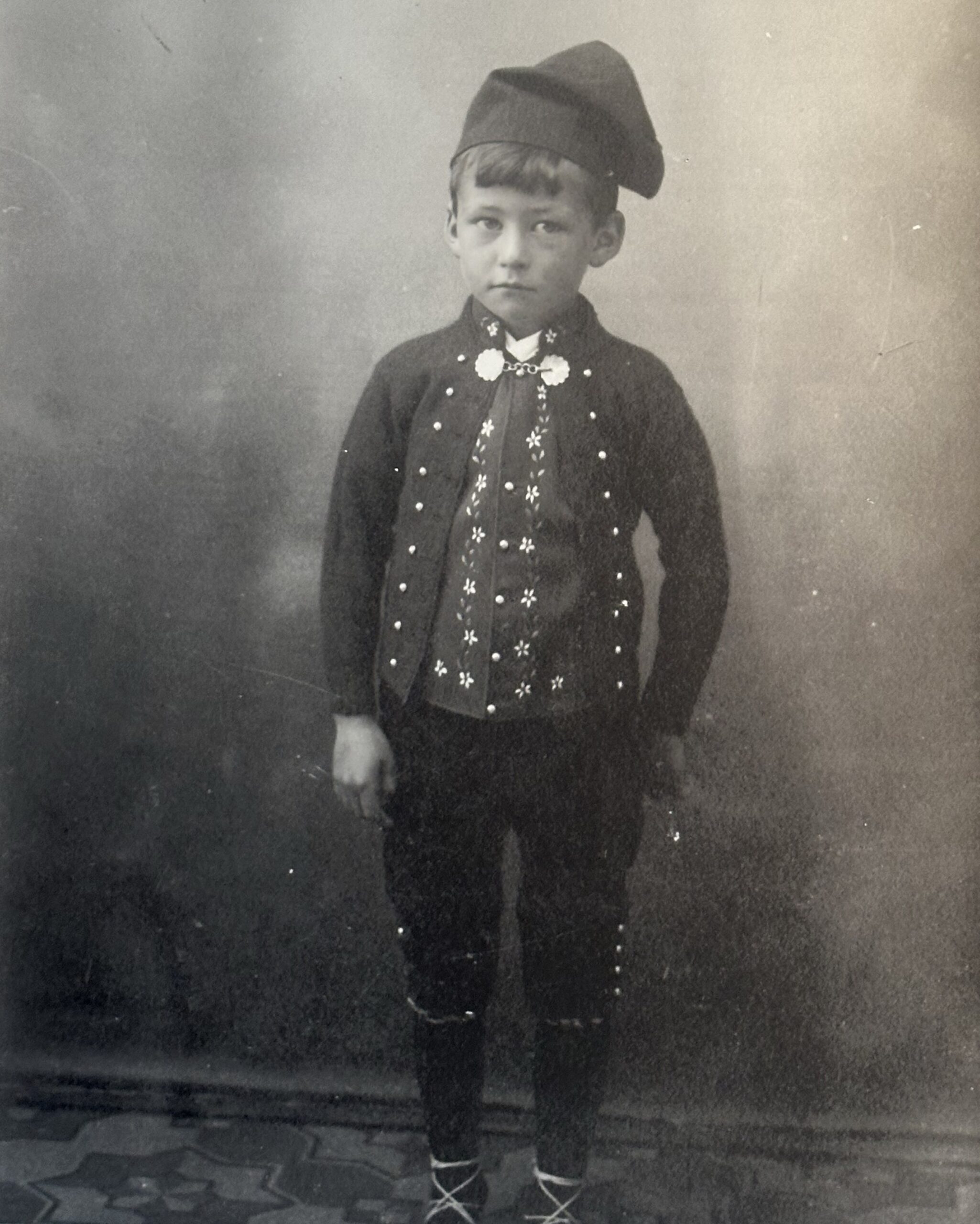 Photo by seth_globepainter on October 14, 2026. May be an image of child, standing, costume, bowler hat, beret and text.