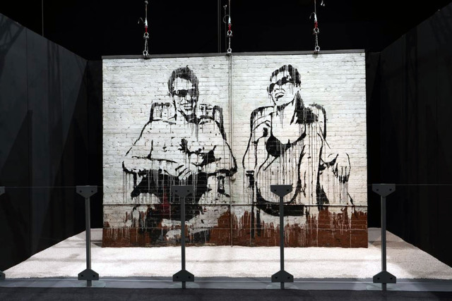 Banksy Stop Esso wall hanging in the Existencilism Los Angeles exhibition