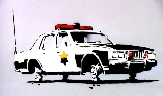 Banksy Police Car print with black and white vehicle and red roof lights