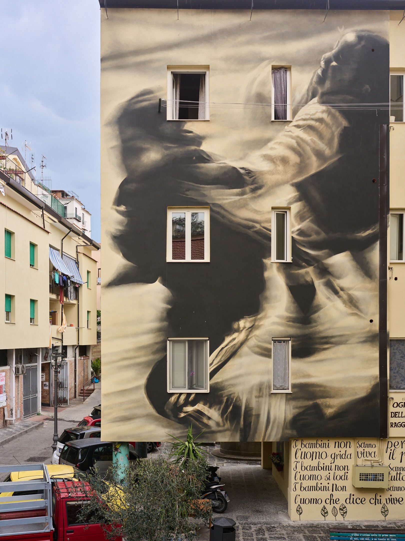 Photo by Guido van Helten on October 01, 2026. May be art of buildings and text.
