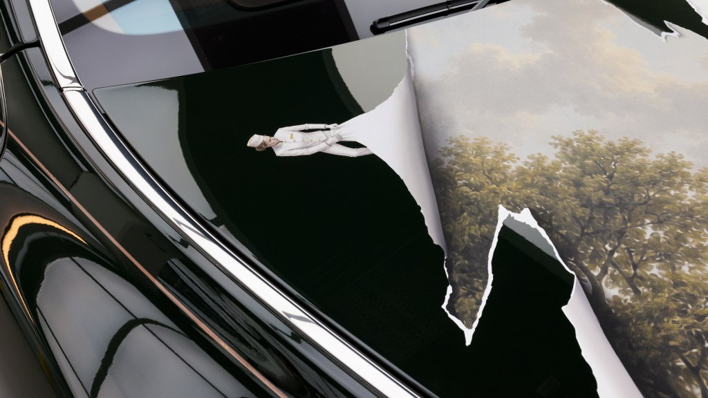 Peeling-surface illusion on a Peninsula London car bonnet